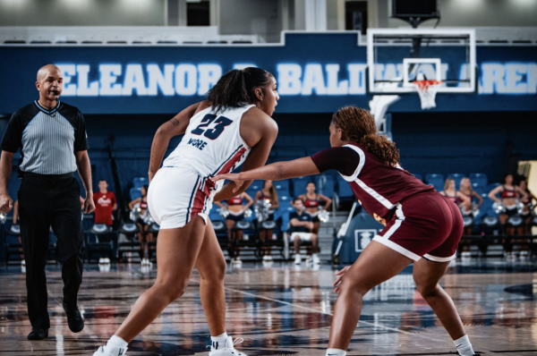 Guard Jada Moore finds a window to pass to a teammate. She ended up being one of the leading players of the game scoring a total of 17 points. 